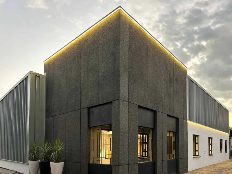 Exterior LED lighting on a commercial building at dusk, installed by Del Group